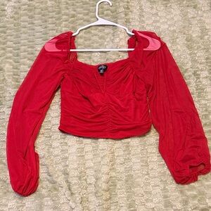 Red stretchy mesh top with puffy sheer sleeves. Size medium